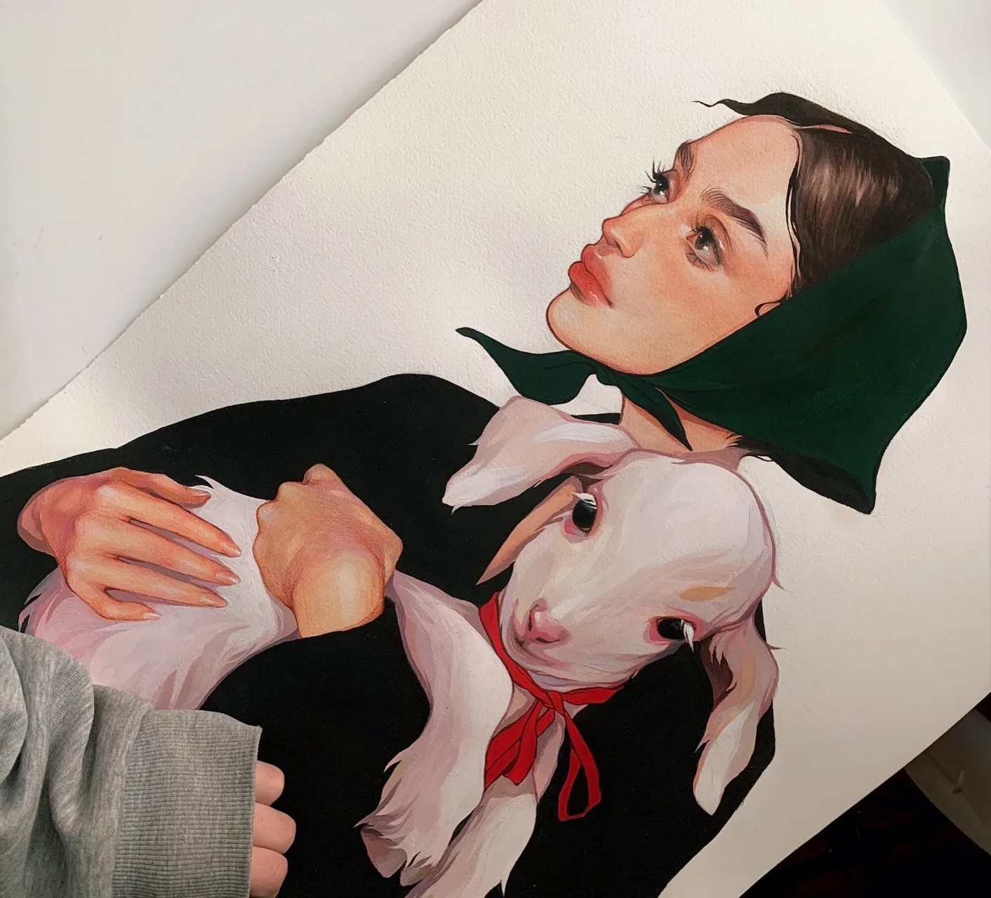 Painting of a woman holding a white lamb