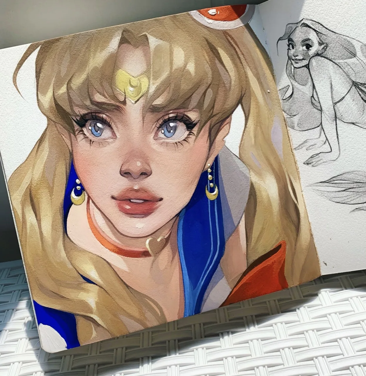 Blonde character painting with drawing materials