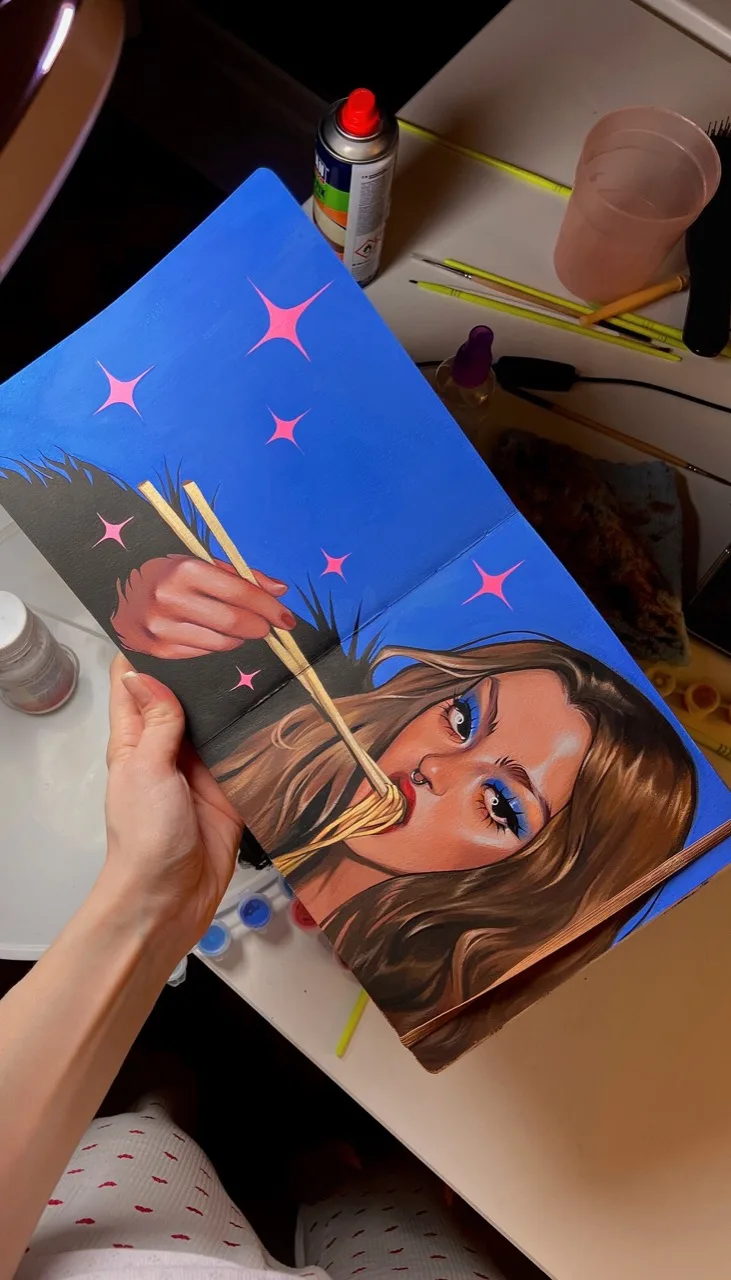 Portrait painting process on a blue background